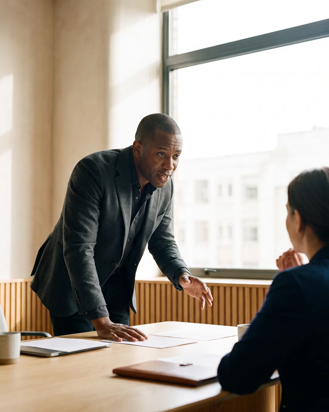 A senior CFO reviewing the work in a calm Austin boardroom